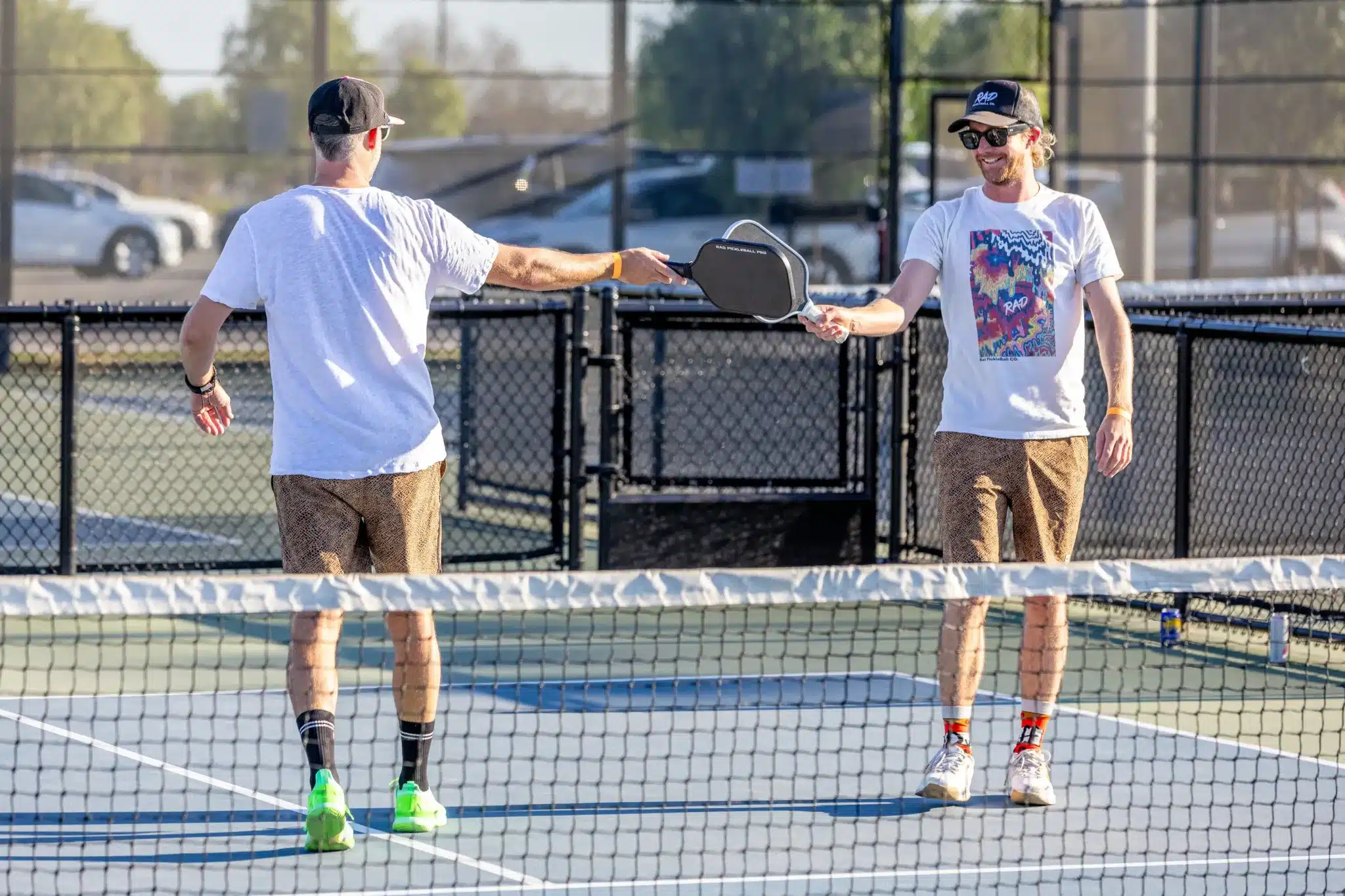 A cheerful, vibrant cover image showcasing a gift card for pickleball lovers surrounded by joyous players.