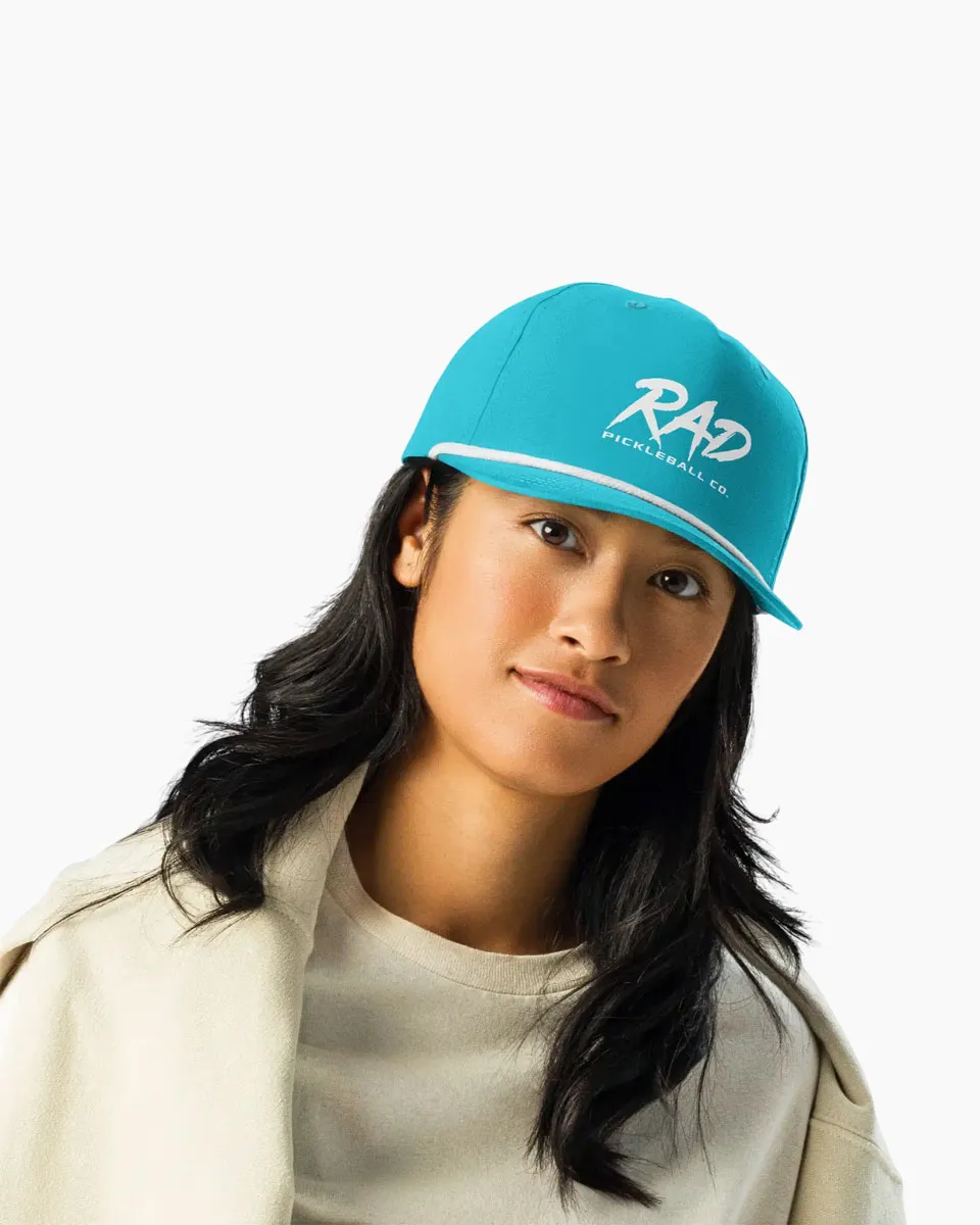 RAD Rope Cap being worn at the pickleball court representing a premium athletic aesthetic