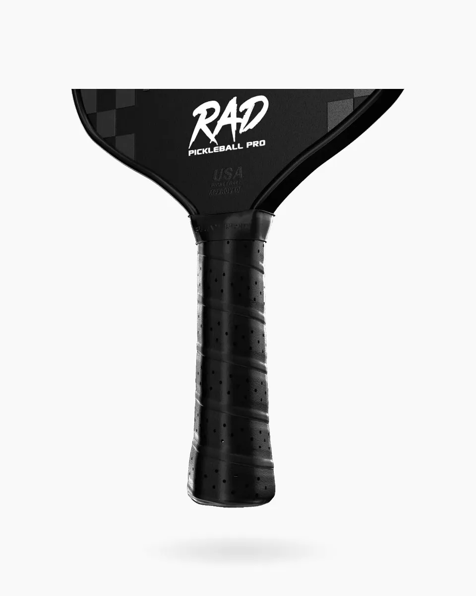 Ergonomic 5.12 inch extended handle on the Retro Pro paddle for two-handed backhands