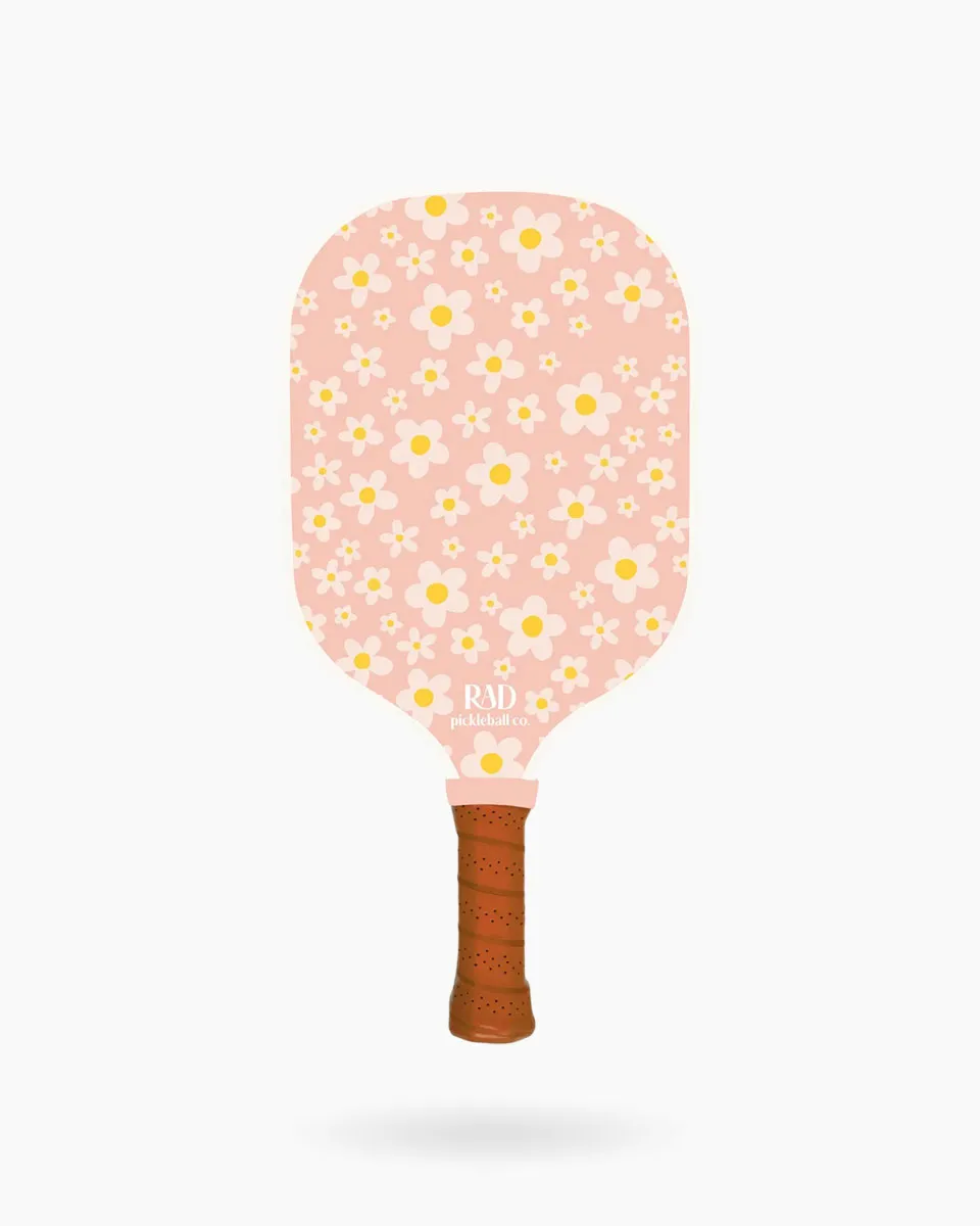 Close-up of the fiberglass surface with Spin Grit texture on the Sunny Daze paddle for elite spin